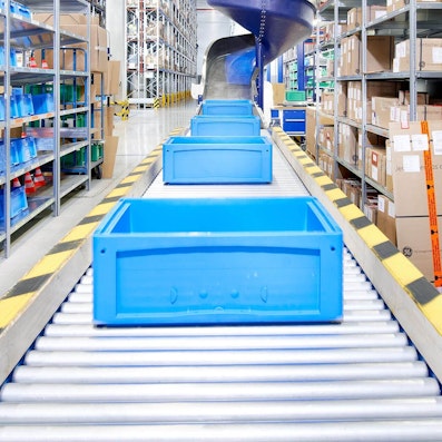 Foto Behälter auf einer Rollenbahn, Referenzn Kühne und Nagel Foto Behälter auf einer Rollenbahn, Referenzn Kühne und Nagel