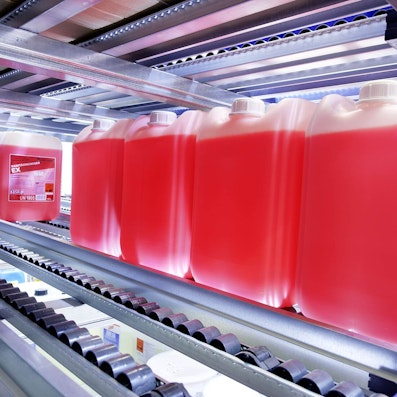 Foto einer Bremsrolle in einer Rollenleiste mit Zylinderrollen für ein Stückgutdurchlaufregal Foto einer Bremsrolle in einer Rollenleiste mit Zylinderrollen für ein Stückgutdurchlaufregal