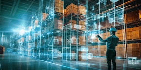 roll of sheet steel, transported by crane at the factory