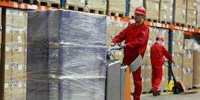 roll of sheet steel, transported by crane at the factory roll of sheet steel, transported by crane at the factory